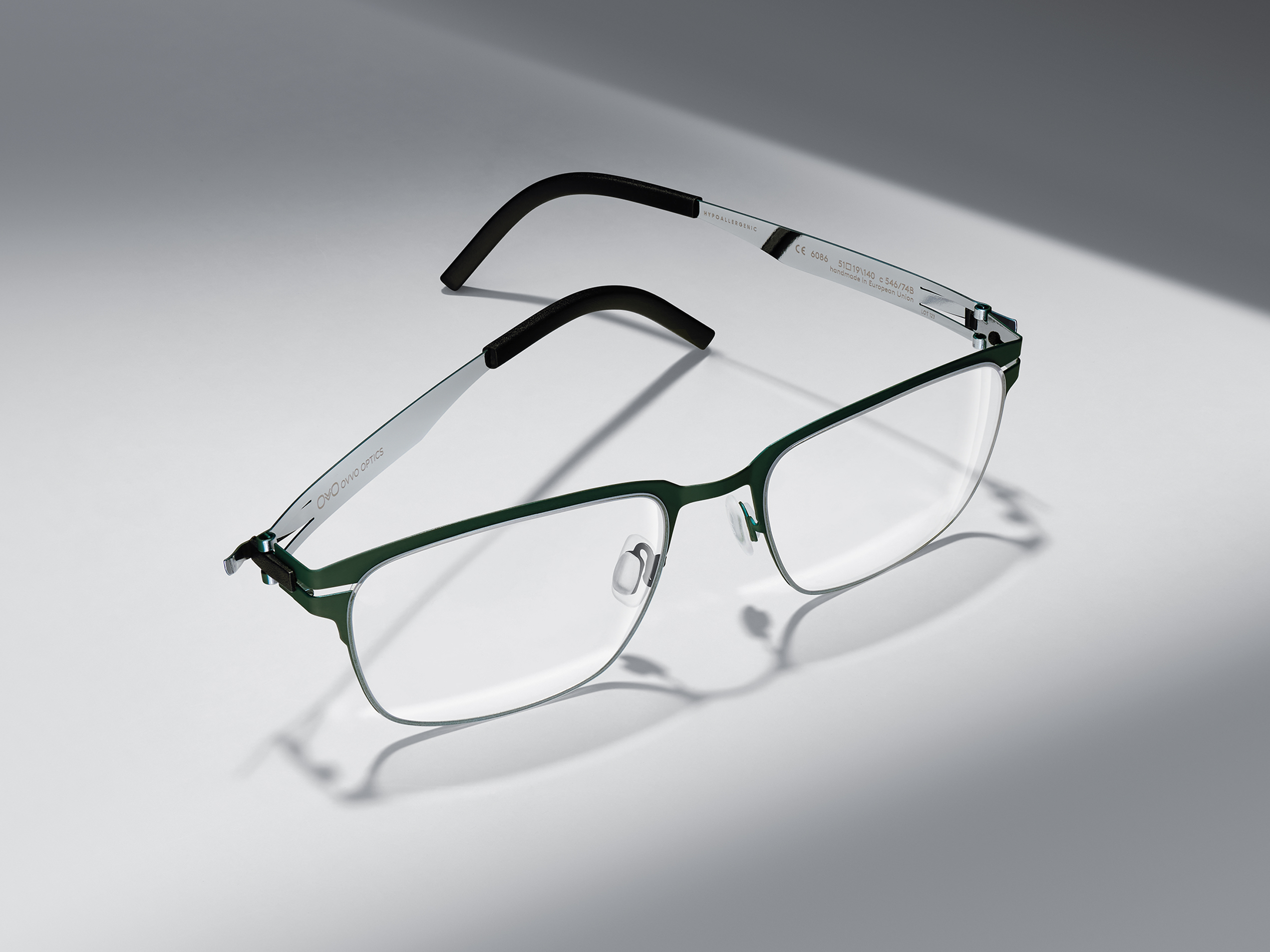 OVVO Optics green rectangular optical frame with black temples in a studio product shot