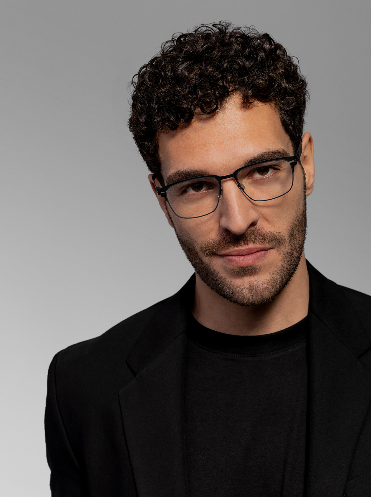 OVVO Optics close-up portrait of a man wearing black rectangular optical eyeglasses