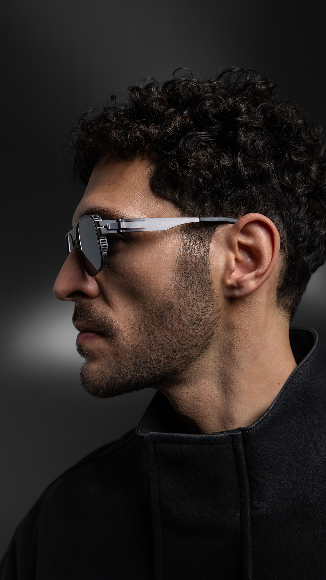 OVVO Optics Ti2 Collection side-profile portrait of a man wearing titanium sunglasses