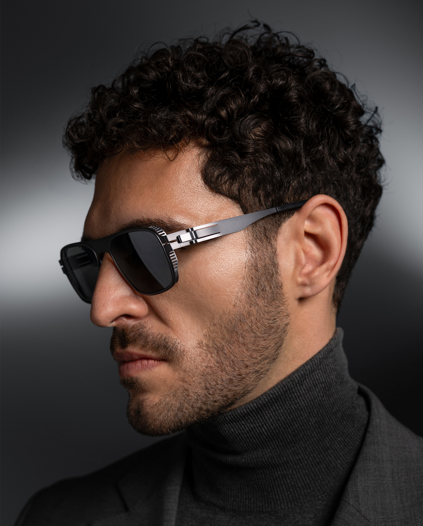 OVVO Optics Ti2 Helios sunglasses portrait of a man in a dark turtleneck