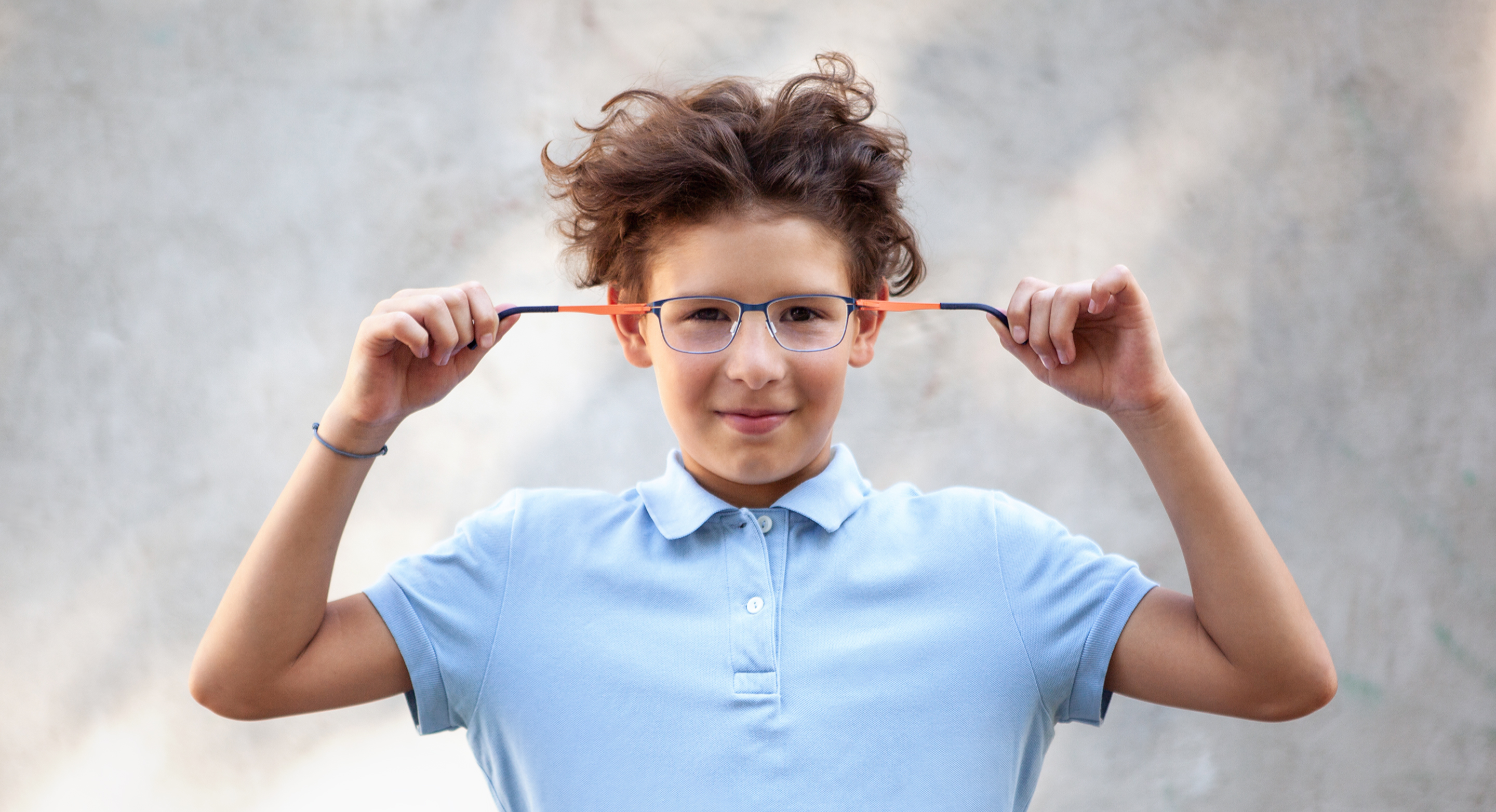 Active children wearing colorful, indestructible OVVO Junior frames designed for play and school.