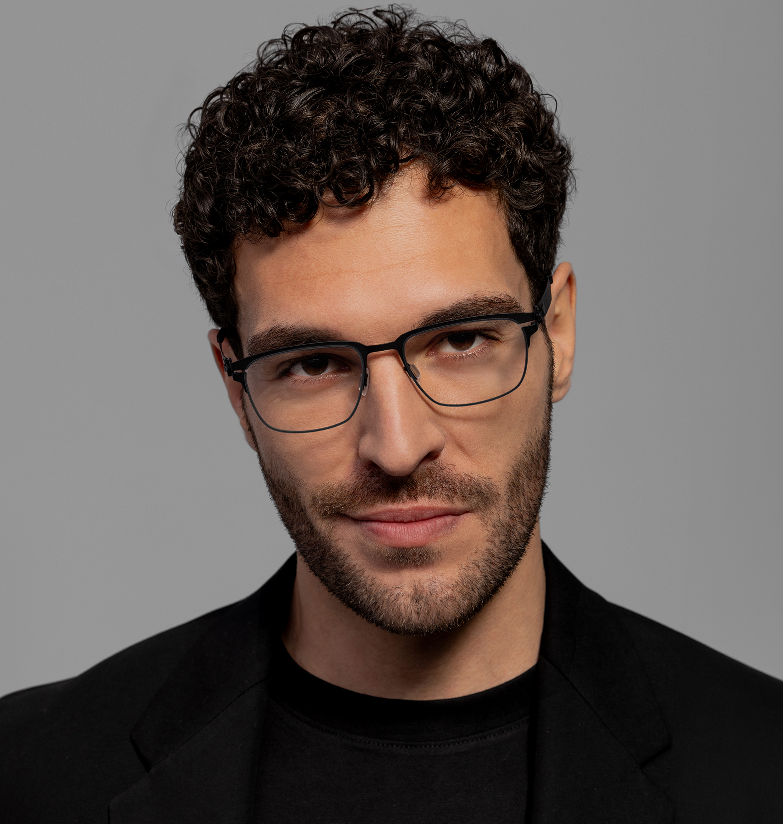 OVVO Optics close-up portrait of a man wearing black rectangular optical glasses