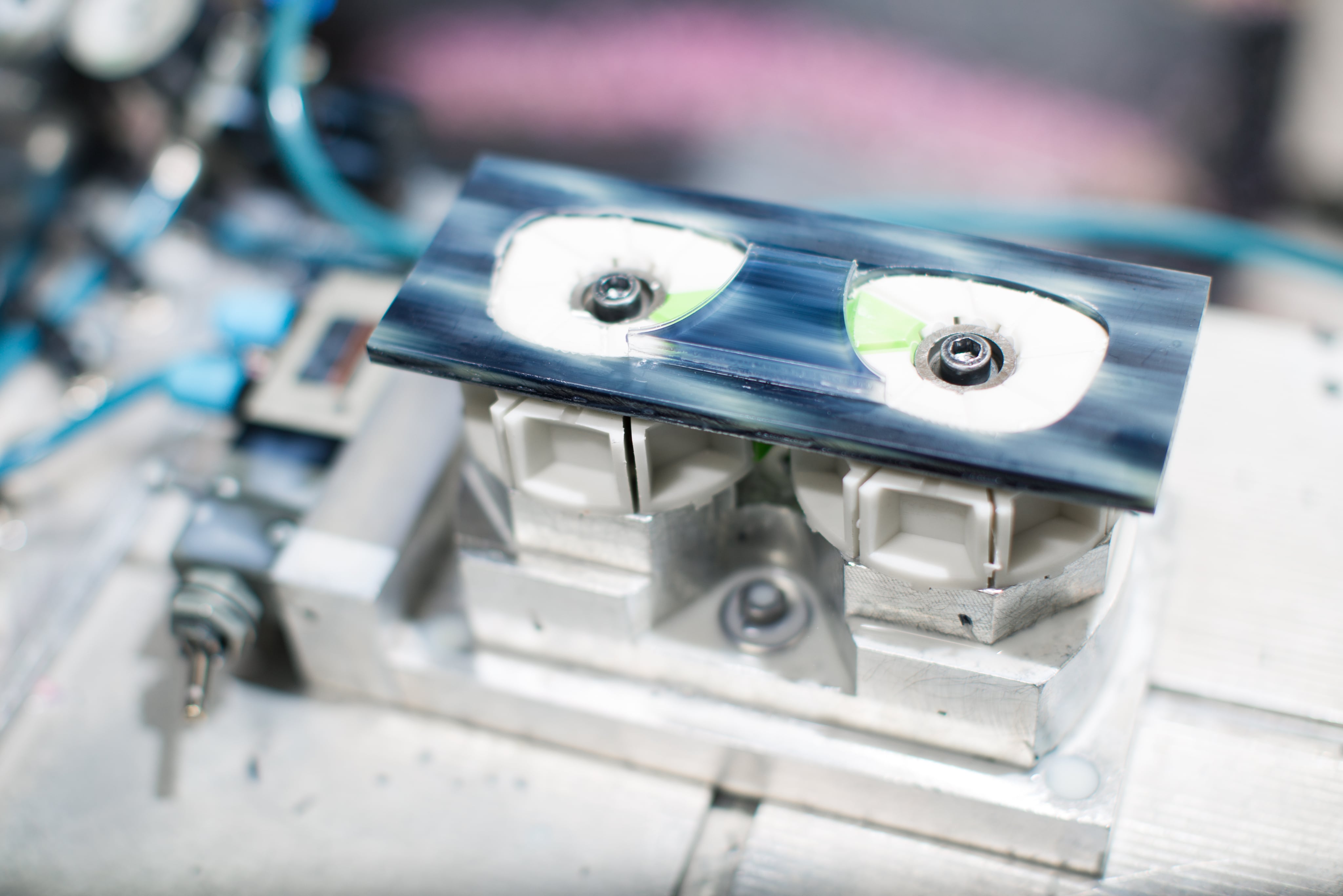 OVVO Optics production engineers collaborating with optical professionals on new eyewear design samples.